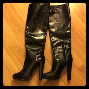Thigh high black leather boots
